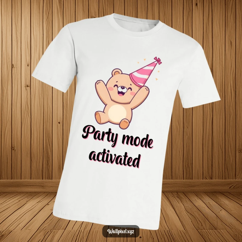 Funny t-shirt: A happy pixelated bear throws a party hat upwards in sheer delight, a festive and humorous design.